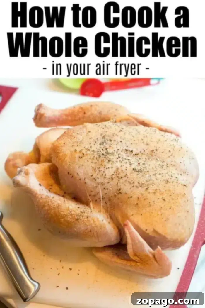 A raw whole chicken, seasoned and prepared for cooking, rests on a wooden cutting board next to a chef's knife. The image emphasizes the preparation stage of an air fryer whole chicken.
