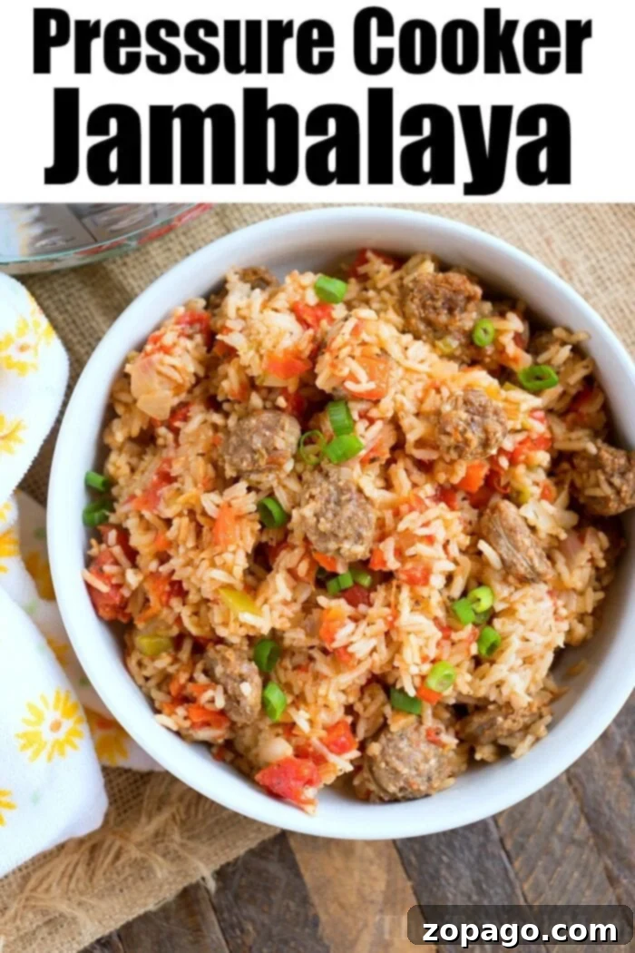 Delicious Pressure Cooker Jambalaya with Spicy Sausage and Vegetables A vibrant pressure cooker jambalaya with sausage, bell peppers, and rice, freshly cooked in an Instant Pot, ready to be served.