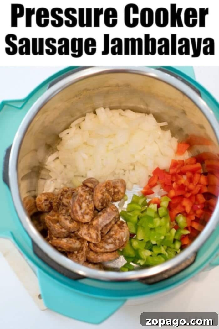 Cooked Pressure Cooker Jambalaya Ready to Serve A pressure cooker pot open, revealing freshly cooked jambalaya with steam rising, showcasing the perfectly fluffed rice and tender ingredients.