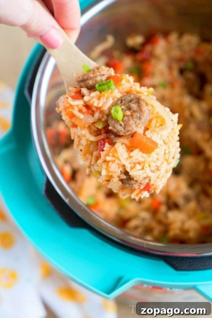 Hearty Pressure Cooker Jambalaya Serving A vibrant and hearty bowl of Pressure Cooker Jambalaya, showcasing a perfect blend of sausage, rice, and colorful vegetables, ready to be enjoyed.