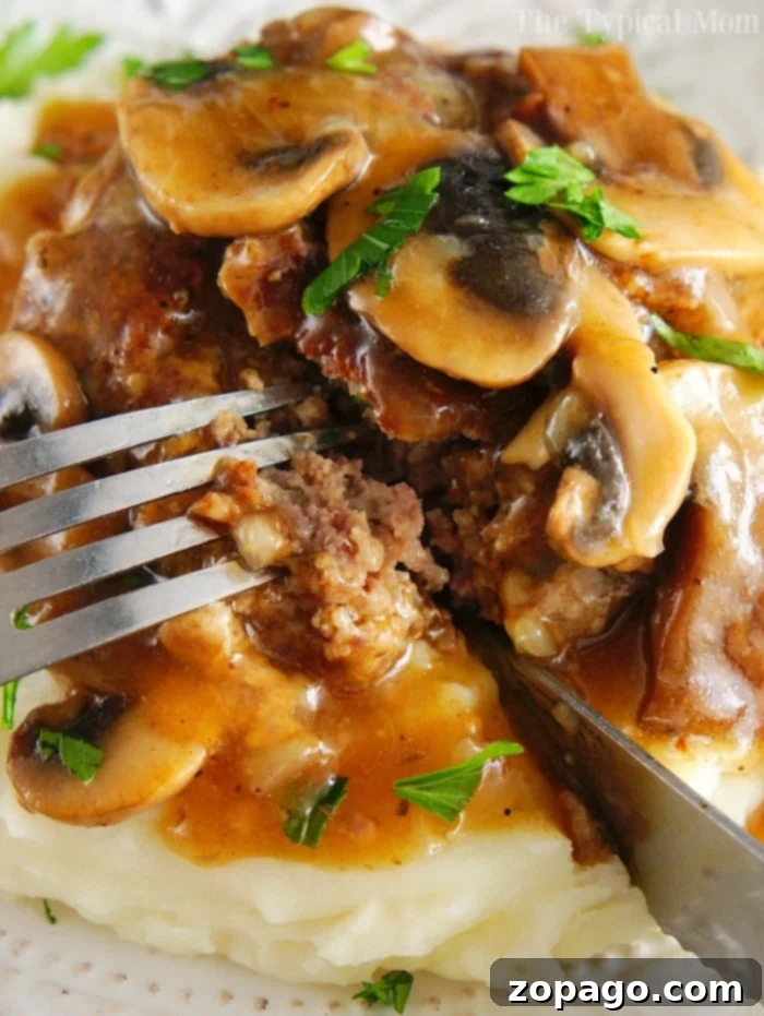 Kid-Friendly Instant Pot Meals 12 Instant Pot Salisbury Steak - A hearty Salisbury steak served with mashed potatoes, a classic comfort food.