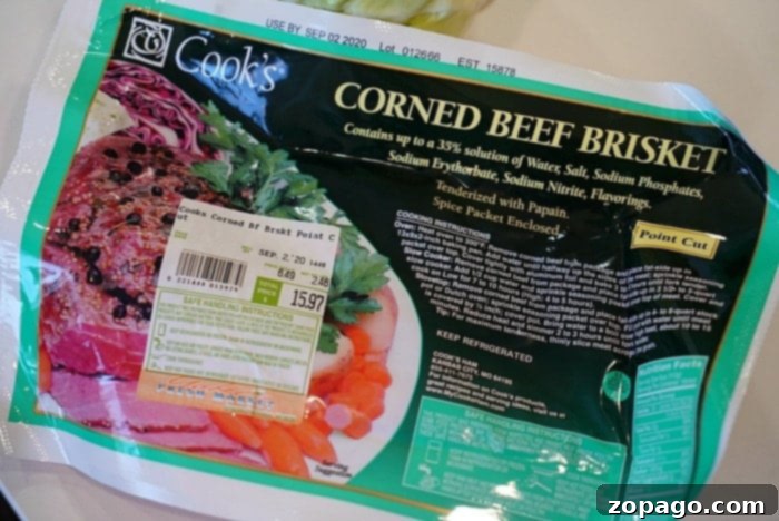 Perfect Corned Beef and Cabbage 3 Succulent slices of corned beef on a cutting board, ready to be served.