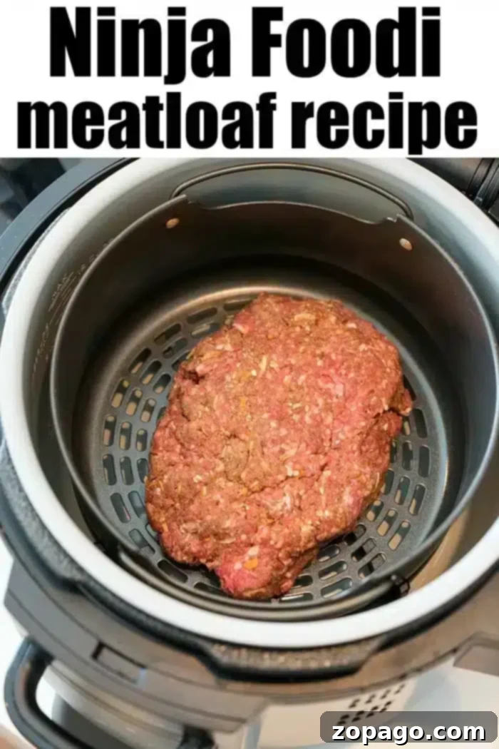 Perfect Ninja Foodi Meatloaf 4 A raw ninja foodi meatloaf sits inside the appliance, ready for cooking. The text above reads "Ninja Foodi meatloaf recipe.