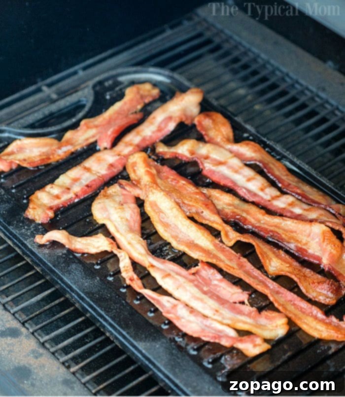 Irresistible Smoked Bacon 5 traeger bacon cooking on grill