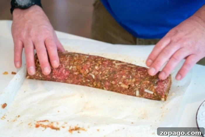 Wood-Fired Traeger Meatloaf 6 Rolled stuffed meatloaf ready for the smoker, showing the filling.