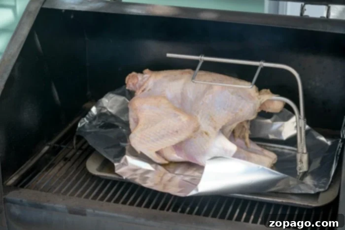 A turkey being cooked on a pellet grill, showcasing the smoking process.