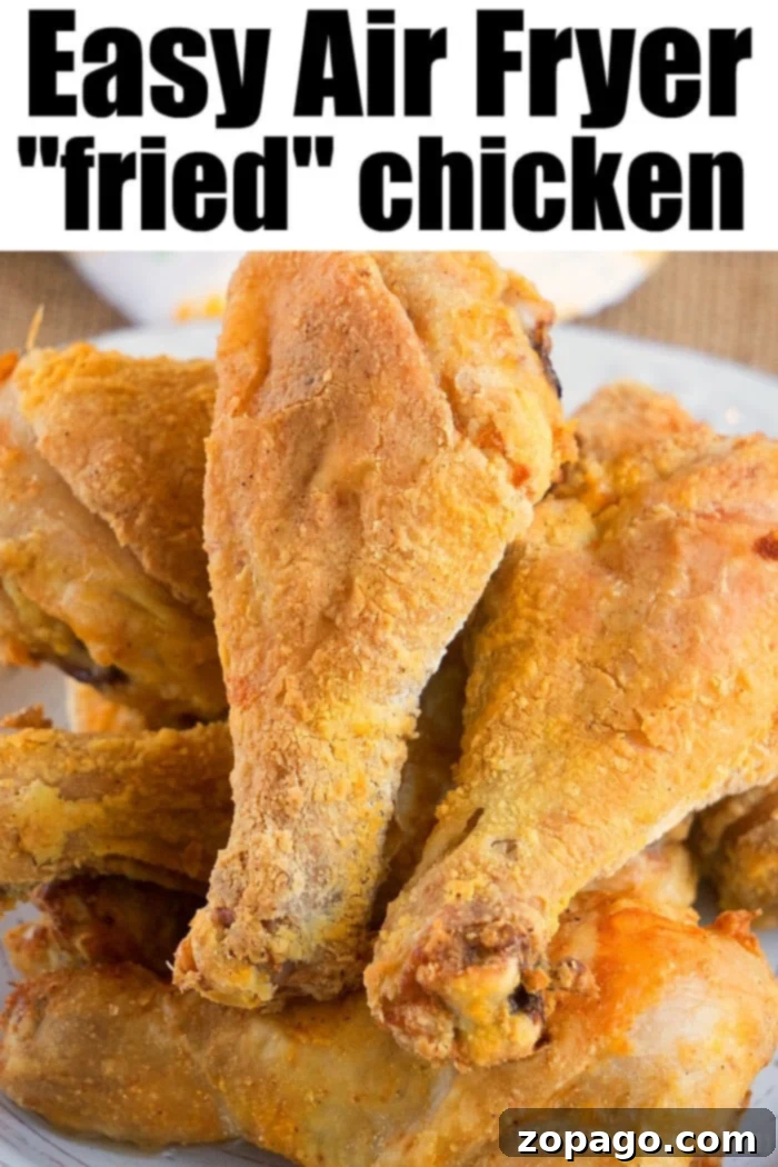 Crispy air-fried chicken drumsticks stacked on a plate make for the perfect dish from your favorite air fryer fried chicken recipe, offering a healthier yet equally delicious alternative.