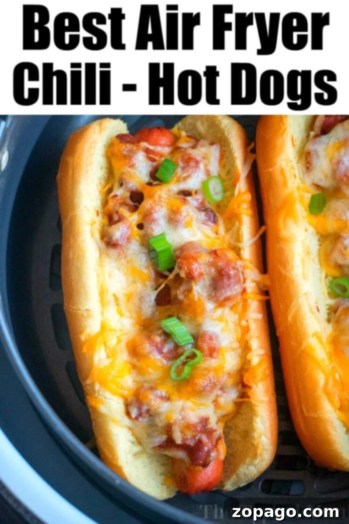 Air fryer hot dogs in buns with toppings, alongside french fries, showcasing an easy and delicious air fryer dinner idea.