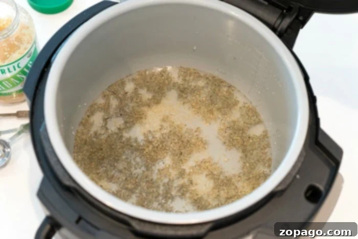 Pressure cooker chicken recipe for Ninja Foodi. Ninja Foodi whole chicken, showcasing the tender meat after pressure cooking, ready for air crisping.