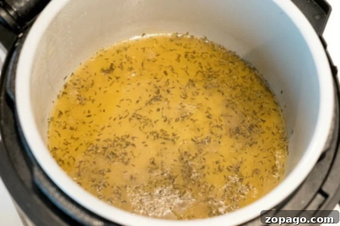 How to make chicken in the Ninja Foodi and use its drippings for gravy. Rich, homemade gravy made from chicken drippings, perfect accompaniment for Ninja Foodi chicken.