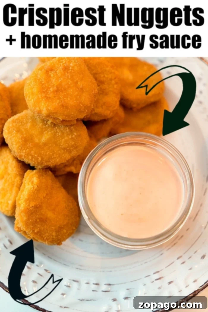 Crispy french fries generously coated in homemade fry sauce, served in a small white bowl.