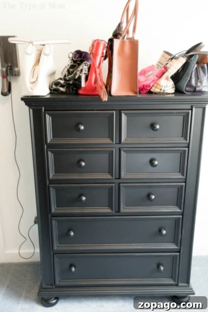 Creating Your Dream Dressing Room 13 DIY blogger standing in a newly renovated walk-in closet, smiling proudly.