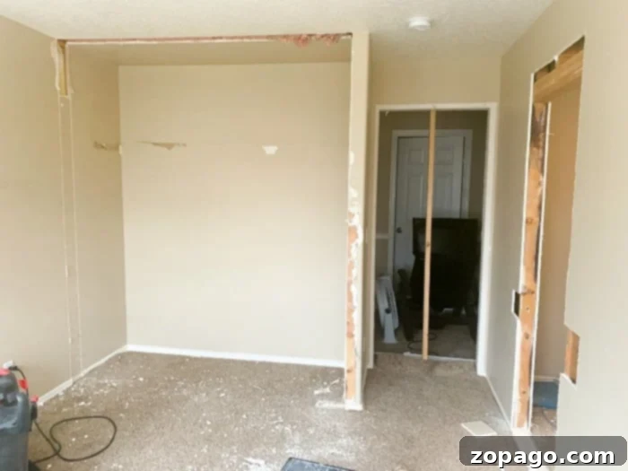 Creating Your Dream Dressing Room 5 Progress shot of a DIY walk-in closet, with new drywall and framing in place.