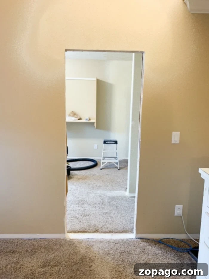 Creating Your Dream Dressing Room 7 Interior view of a spacious DIY walk-in closet with ample hanging space and shelves.