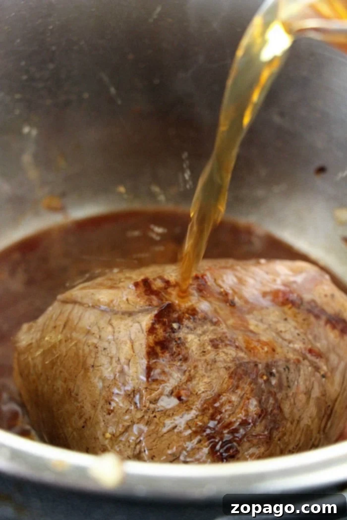 Instant Pot beef roast with vegetables comes out incredibly tender! If you're looking for a new Instant Pot or Ninja Foodi recipe for dinner, try this. #pressurecookerrecipes #roast #beefroast #instantpotroast #instantpotrecipes #ninjafoodi #foodi #ninjafoodirecipes Pressure Cooker Beef Roast Ready to Serve