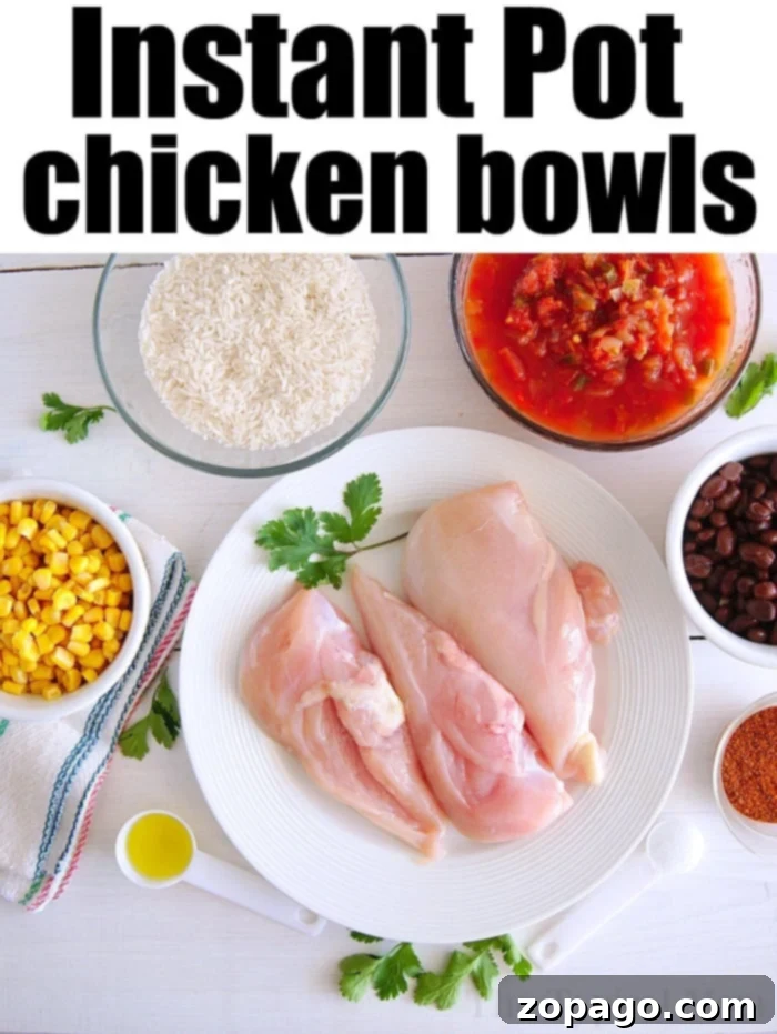 Pressure cooker chicken taco bowls are the best 15 minute dinners! A one pot meal with corn, black beans, rice and tender chicken all in a bowl. #instantpot #chicken #ninjafoodi #crockpotexpress #tacos #chickentacobowl A vibrant Instant Pot Chicken Taco Bowl filled with shredded chicken, rice, black beans, corn, fresh avocado slices, and a dollop of sour cream, ready to be enjoyed.