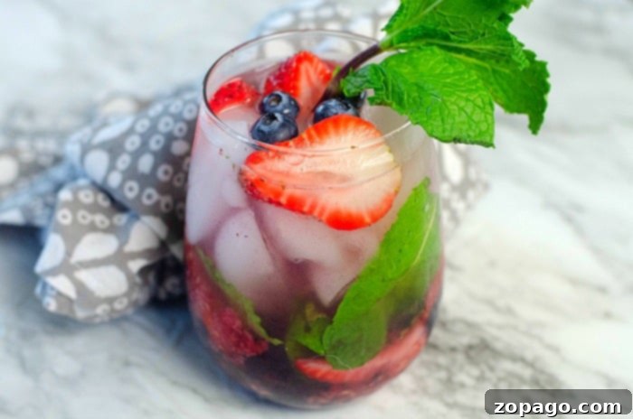 Effortless Berry Mojito 5 Ingredients for a mojito recipe with rum, including fresh mint, limes, berries, and rum