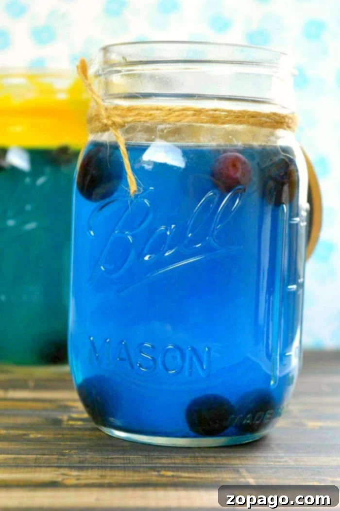 Beat the Heat: 10 Must-Try Summer Cocktails 3 Two glasses of vibrant blue drinks with lime wedges, suitable for a baby shower or any summer gathering