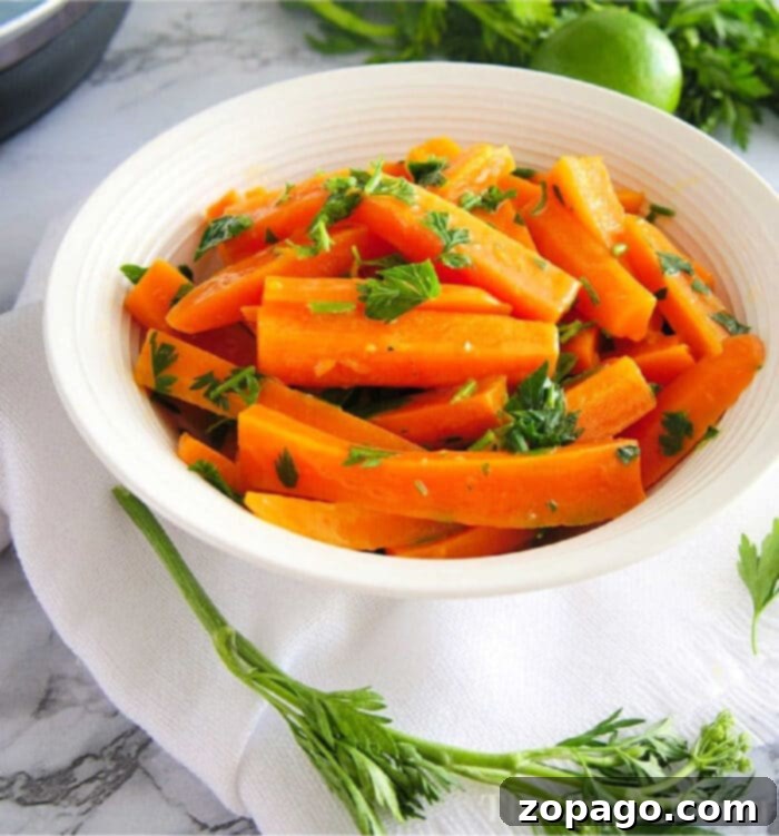 Quick and Tender Pressure Cooker Carrots 2 Perfectly cooked pressure cooker carrots, garnished with fresh parsley and a squeeze of lime.