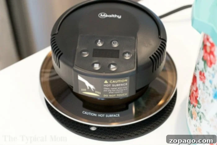 Achieve perfect crispness with the MICHELANGELO Air Fryer Lid. Mealthy CrispLid (now MICHELANGELO Air Fryer Lid) in use