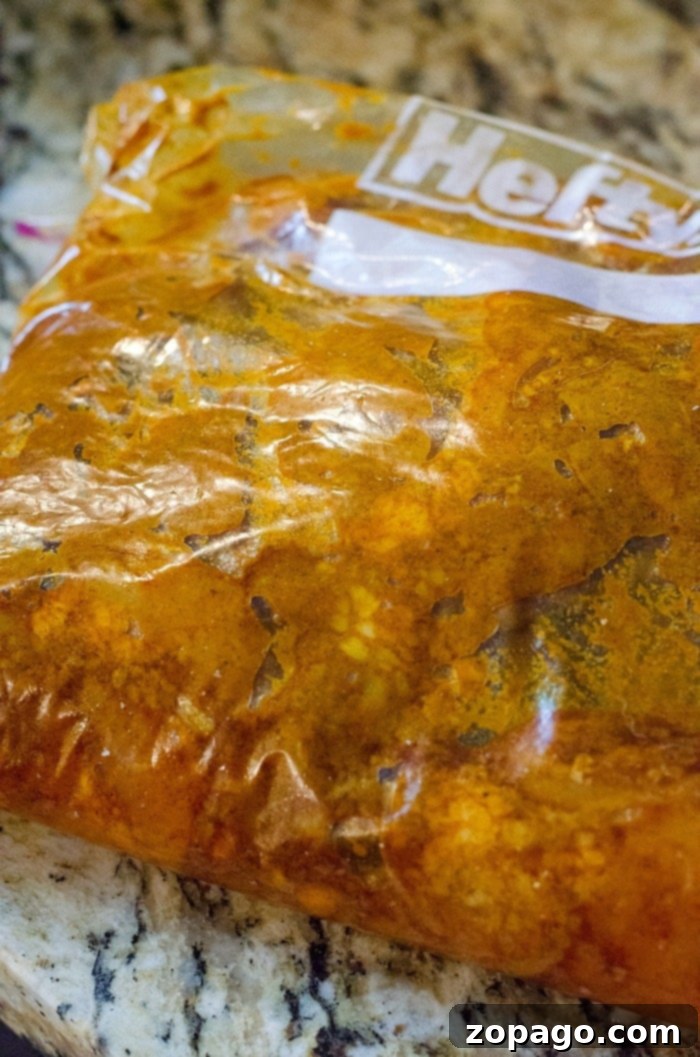 Instant Pot Chicken Shawarma: Your New Favorite Dinner 4 Delicious chicken pieces soaking in a vibrant shawarma marinade