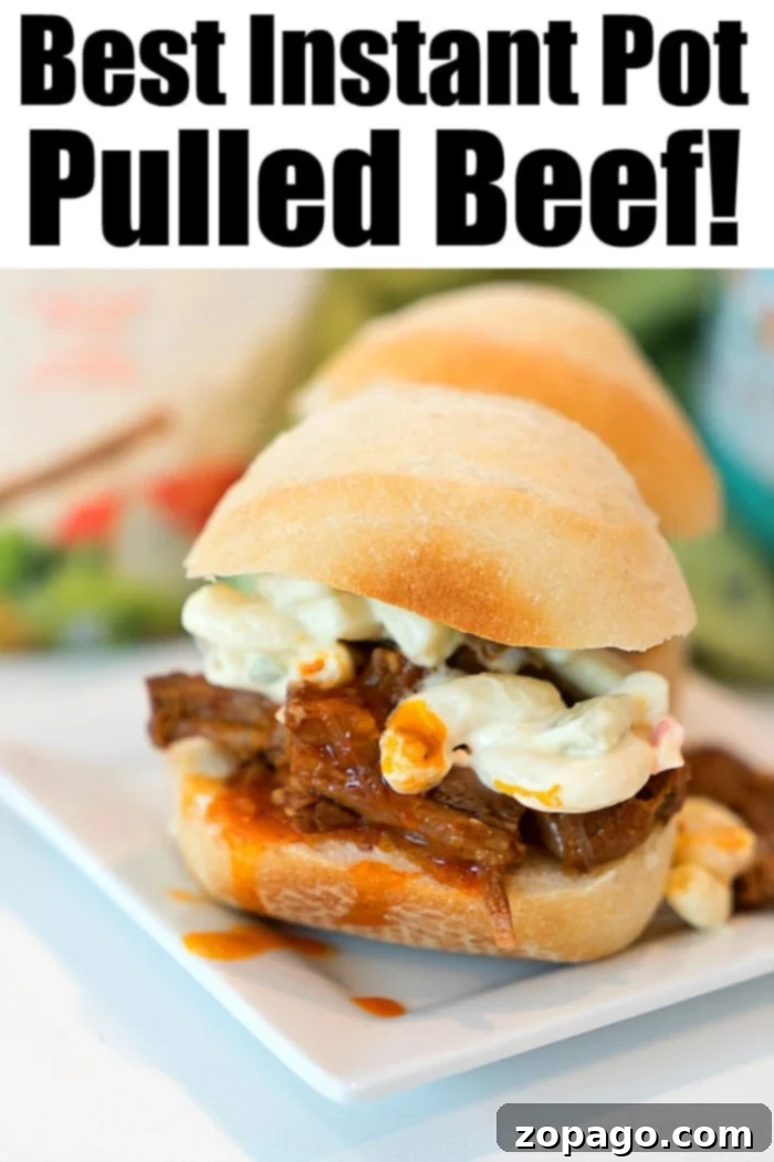 Try Instant Pot pulled beef for dinner tonight! Tender meat stacked on rolls to make sliders = a great appetizer or dinner for your family. Instant Pot pulled beef ready for serving, piled high on buns or alongside delicious sides.