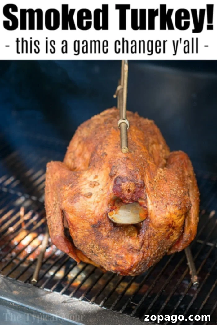 Flawlessly Moist Turkey Every Time 5 A whole smoked turkey, boasting crispy, golden-brown skin with visible seasoning, hangs on a metal hook inside a smoker. Text at the top reads,