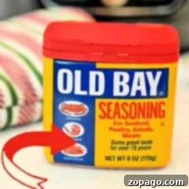 Homemade Old Bay Seasoning in a classic container, symbolizing its perfect pairing with seafood, poultry, salads, and various meats. Learn to make this authentic spice blend from scratch.