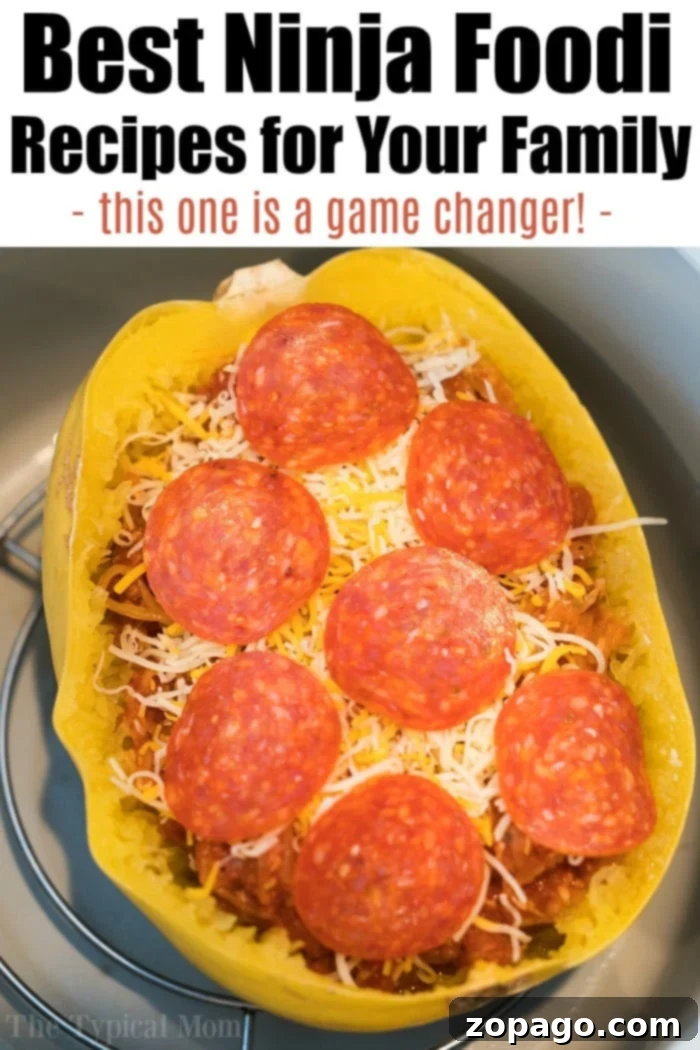 Ninja Foodi recipes you will love. #ninjafoodi #pizza A freshly made Ninja Foodi pizza, featuring a golden, bubbly cheese topping and delicious pepperoni.