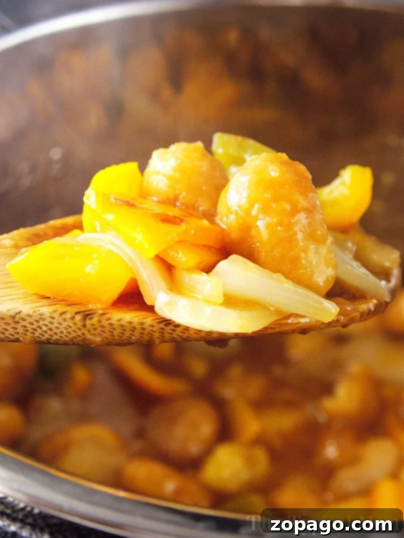EASY Instant Pot sweet and sour chicken made with frozen popcorn chicken is the easiest meal ever that everyone loves! Panda Express copycat recipe for sure. Pressure cooker sweet and sour chicken recipe