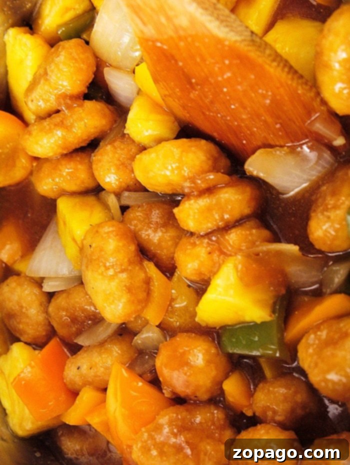 Pressure cooker sweet and sour chicken made with frozen popcorn chicken is the easiest meal ever that everyone loves! Panda Express copycat recipe for sure. Ninja Foodi Sweet and Sour Chicken cooked to perfection
