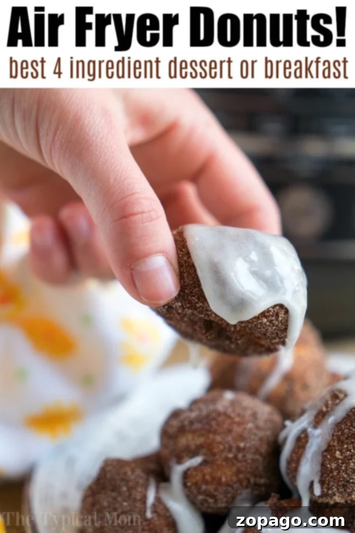Air fryer desserts are here!! If you're ready to learn how to make an air fryer cake or brownies in a Ninja Foodi, we're here to guide you along. #airfryer #airfryerrecipes #airfryerdessert #cake #brownies A hand holds a glazed donut over a stack of similar delights. The text reads, Air Fryer Donuts! Discover the best 4 ingredient air fryer donut recipe for dessert or breakfast.