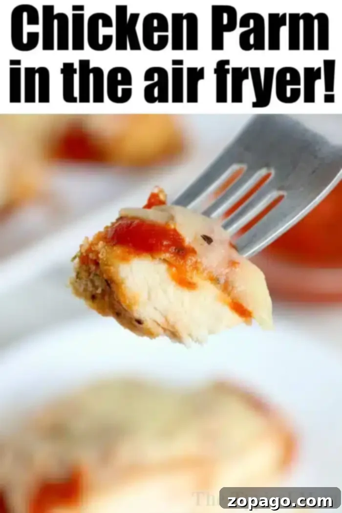 Delicious Air Fryer Chicken Parmesan on a Fork A fork holds a piece of air fryer chicken parm with red sauce and melted cheese. Text at the top reads, 'Chicken Parm in the air fryer!' A blurred background features more deliciously crisp chicken parm.