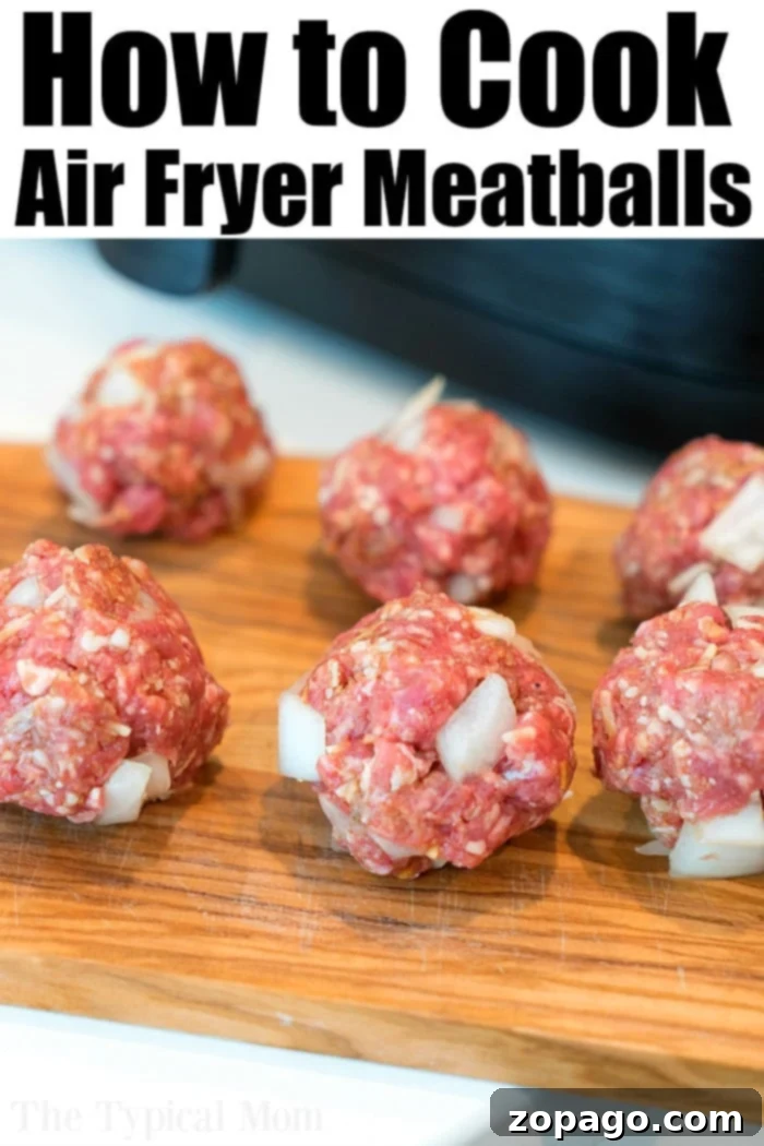 Easy Air Fryer Meatballs 6 Freshly cooked homemade meatballs in air fryer, showing their delicious texture.