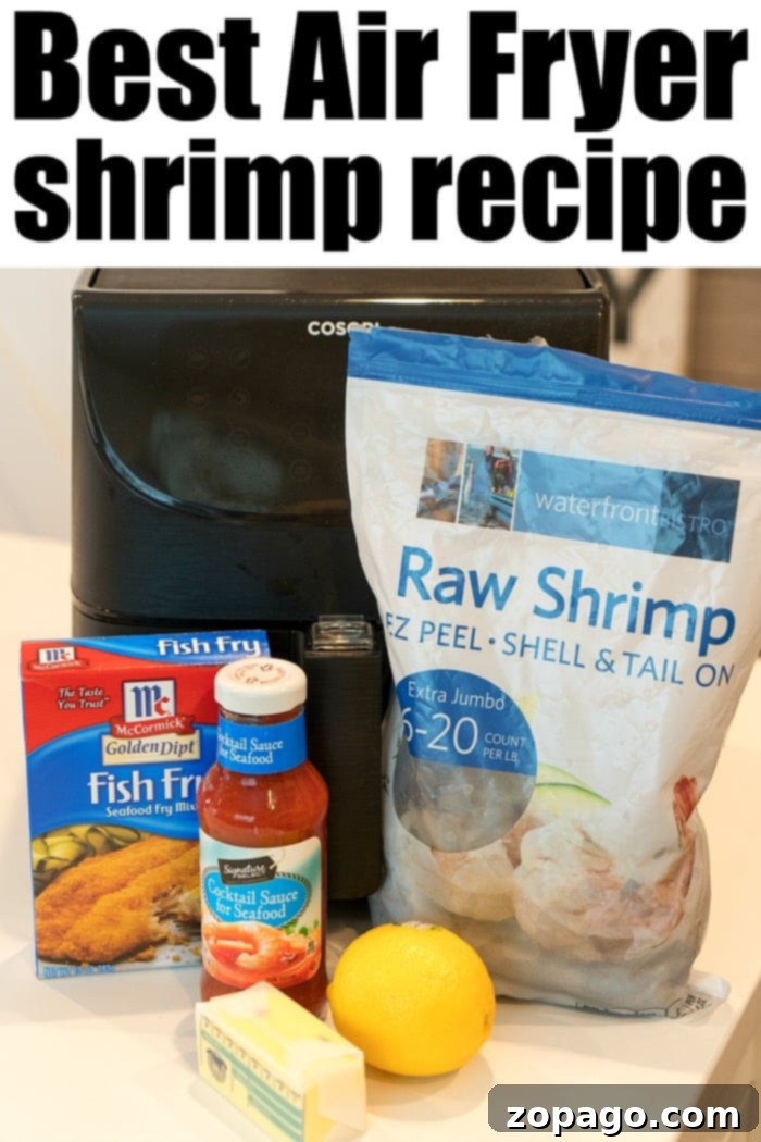 How to make air fryer shrimp! With a light breading & tons of flavor they're crispy to perfection in just a few minutes with NO frying required. Ingredients for making air fryer fried shrimp including raw shrimp, seasoning, cocktail sauce, lemon, and butter