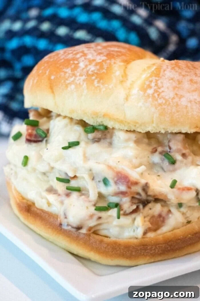 Discover top-rated Crockpot chicken recipes: easy, family-friendly, and budget-conscious slow cooker meals with step-by-step guides. #crockpotrecipes #crockpotchicken #slowcookerchicken #easyrecipes #familydinners A delicious crockpot creamy chicken and bacon sandwich, garnished with fresh chives on a soft bun, representing the best slow cooker chicken recipes for families.