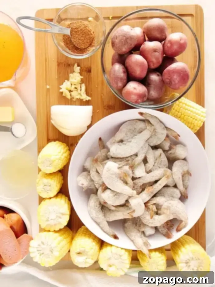 Quick Instant Pot Shrimp Boil 5 A mouth-watering image of an Instant Pot shrimp boil served family-style on a large platter, with corn, potatoes, sausage, and shrimp.