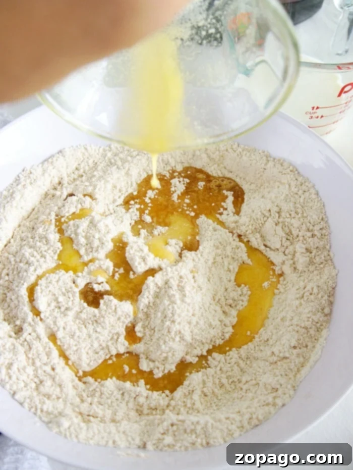 Easy Instant Pot Peach Cobbler 4 A golden-brown peach cobbler with a bubbly fruit filling, presented in a small baking dish, fresh out of the pressure cooker.