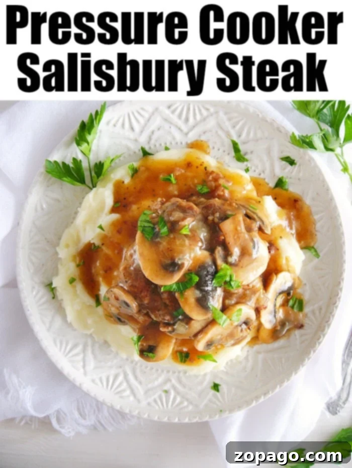 Instant Pot Salisbury Steak: The ultimate comfort food with tender patties and rich gravy for a perfect dinner. Hearty Instant Pot Salisbury steak with gravy and mashed potatoes, garnished with fresh herbs, ready to be served as a comforting meal.
