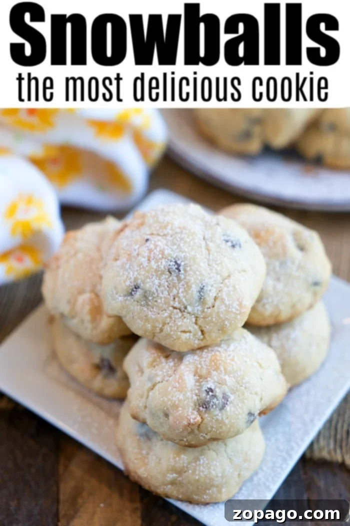 Pecan snowball cookies are the classic shortbread Christmas cookies you remember from your childhood. Add nuts or chocolate chips for a yummy treat. #snowballcookies #christmascookies #cookies #shortbread A festive pile of Pecan Snowball Cookies, ready to be enjoyed during Christmas.