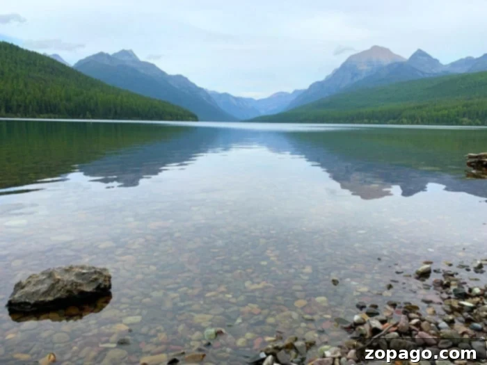 When to Visit Glacier National Park for the Trip of a Lifetime 5 Stunning Bowman Lake in Glacier National Park at sunset