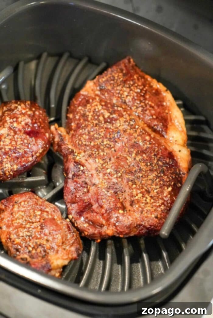 Ninja Foodi Grill Steak: Juicy and Flavorful Perfectly grilled steak with visible sear marks, cooked in the Ninja Foodi Grill.