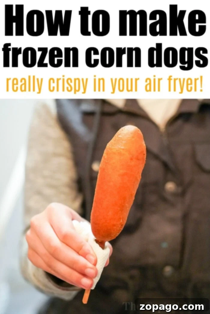 Crispy Air-Fried Corn Dogs 4 Two perfectly air-fried frozen corn dogs on a small plate, ready to be enjoyed, with a slightly blurred background.