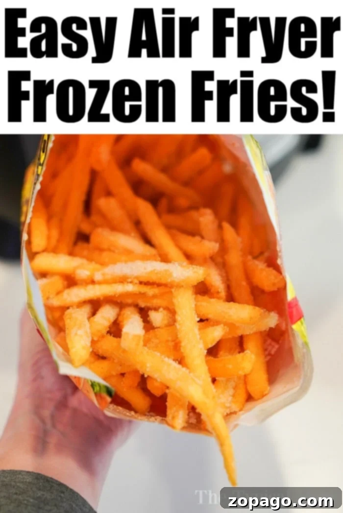 Air fryer french fries are the best!! Crispy just like at a restaurant but healthier since you do NOT have to fry them in oil. Game Changer! #airfryer #airfryerfrenchfries #frenchfries #ninjafoodi #foodi Delicious french fries cooking in an air fryer basket, achieving perfect crispness.