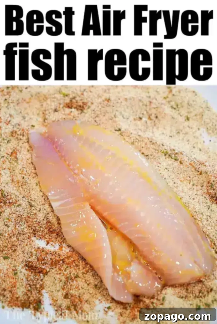 Air fryer tilapia is easy to make! Using fresh, frozen, or previously frozen fillets you can make tasty fish that's crunchy on the outside and flaky within. #airfryer #airfryerfish #airfryerrecipes #ninjafoodi #ninjafoodirecipes #tilapia #airfryertilapia A raw tilapia fillet is shown on a layer of seasoned breadcrumbs. The text above the image reads, "Best Air Fryer Fish Recipe.