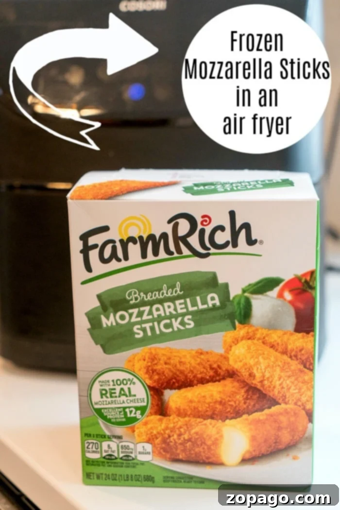 Crispy frozen mozzarella sticks ready from the air fryer. Frozen mozzarella sticks perfectly cooked in an air fryer basket, showcasing their golden crispiness.