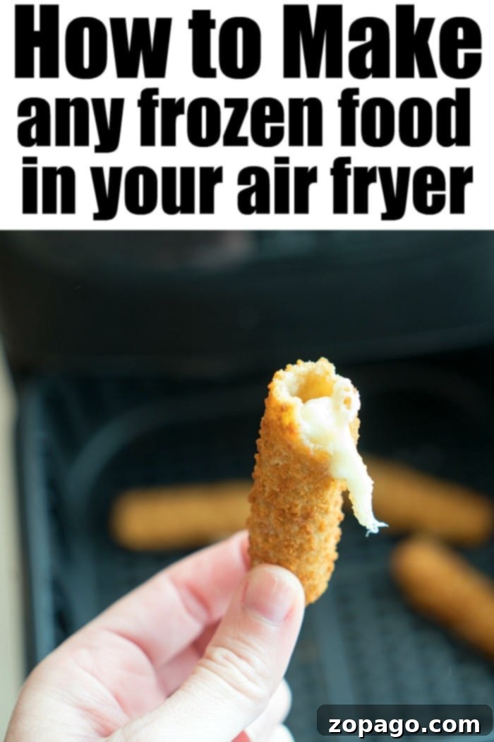 Explore the versatility of air frying with various frozen foods. A basket full of various air fryer frozen foods, including mozzarella sticks, french fries, and chicken nuggets.