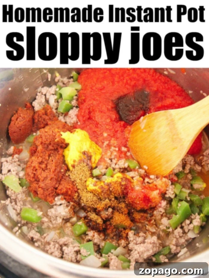 Homemade sloppy joes is an easy protein packed meal even your kids will love. If you're looking for pressure cooker ground beef recipes, this is #1. #instantpotsloppyjoes #instapot #instantpotrecipeseasy #instantpotrecipes #sloppyjoes A close-up of a homemade Instant Pot sloppy joe sandwich on a sesame seed bun with a blurred background.