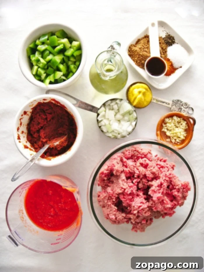 Sloppy joes are an easy protein packed meal even your kids will love. If you're looking for pressure cooker ground beef recipes, this is #1. #instantpotsloppyjoes #instapot #instantpotrecipeseasy #instantpotrecipes #sloppyjoes Two pressure cooker sloppy joe sandwiches on a wooden board, garnished with pickles and onions.
