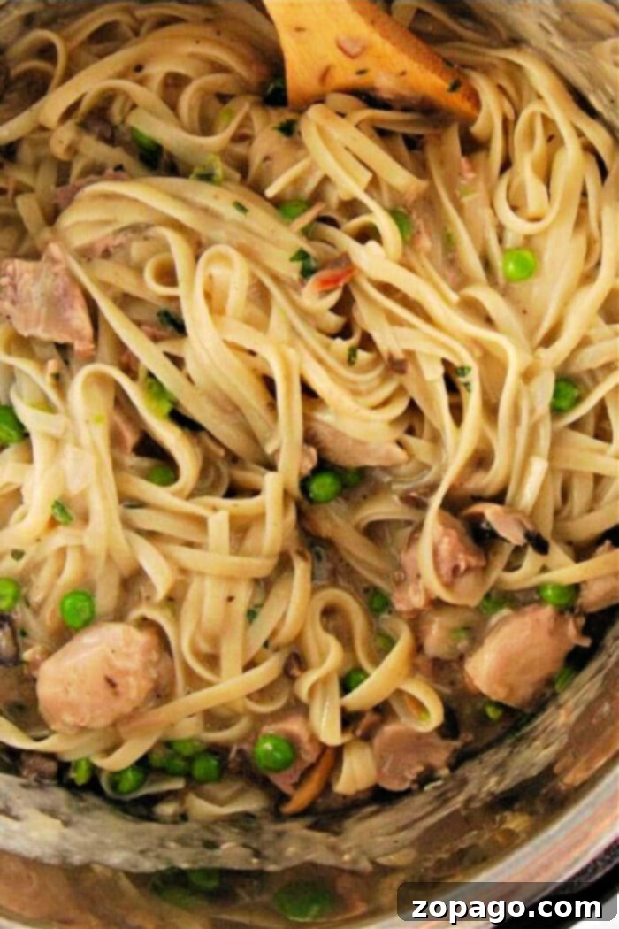 Creamy Instant Pot Turkey Tetrazzini 2 Savor the delightful twist on classic comfort food: Pasta with chicken, mushrooms, and peas gently stirred in a creamy sauce, reminiscent of an instant pot turkey tetrazzini.